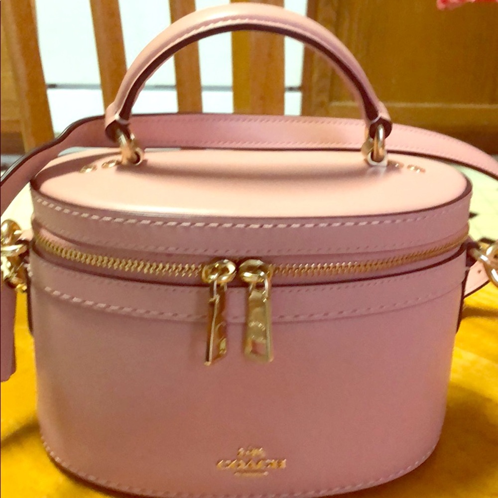 Light pink small Coach crossbody bag